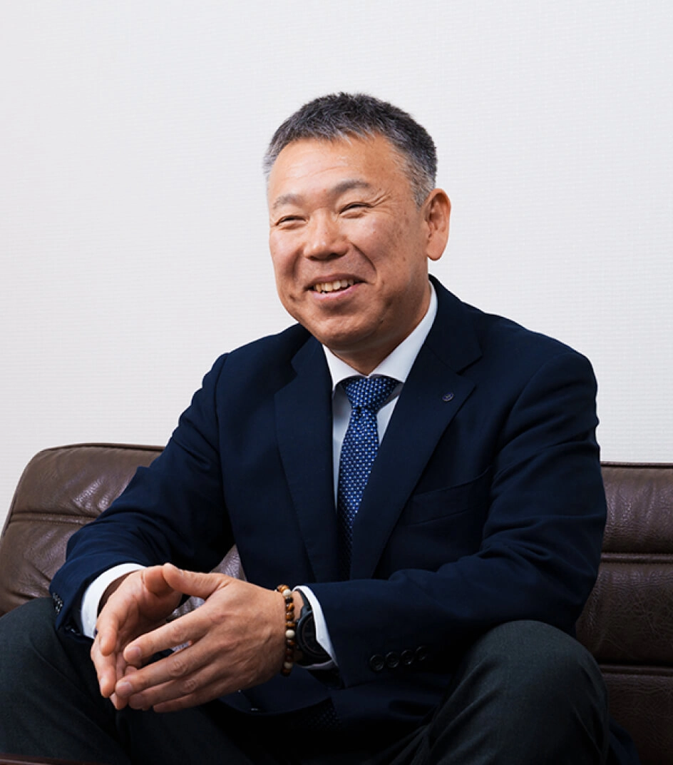 笑顔の斎藤社長の写真